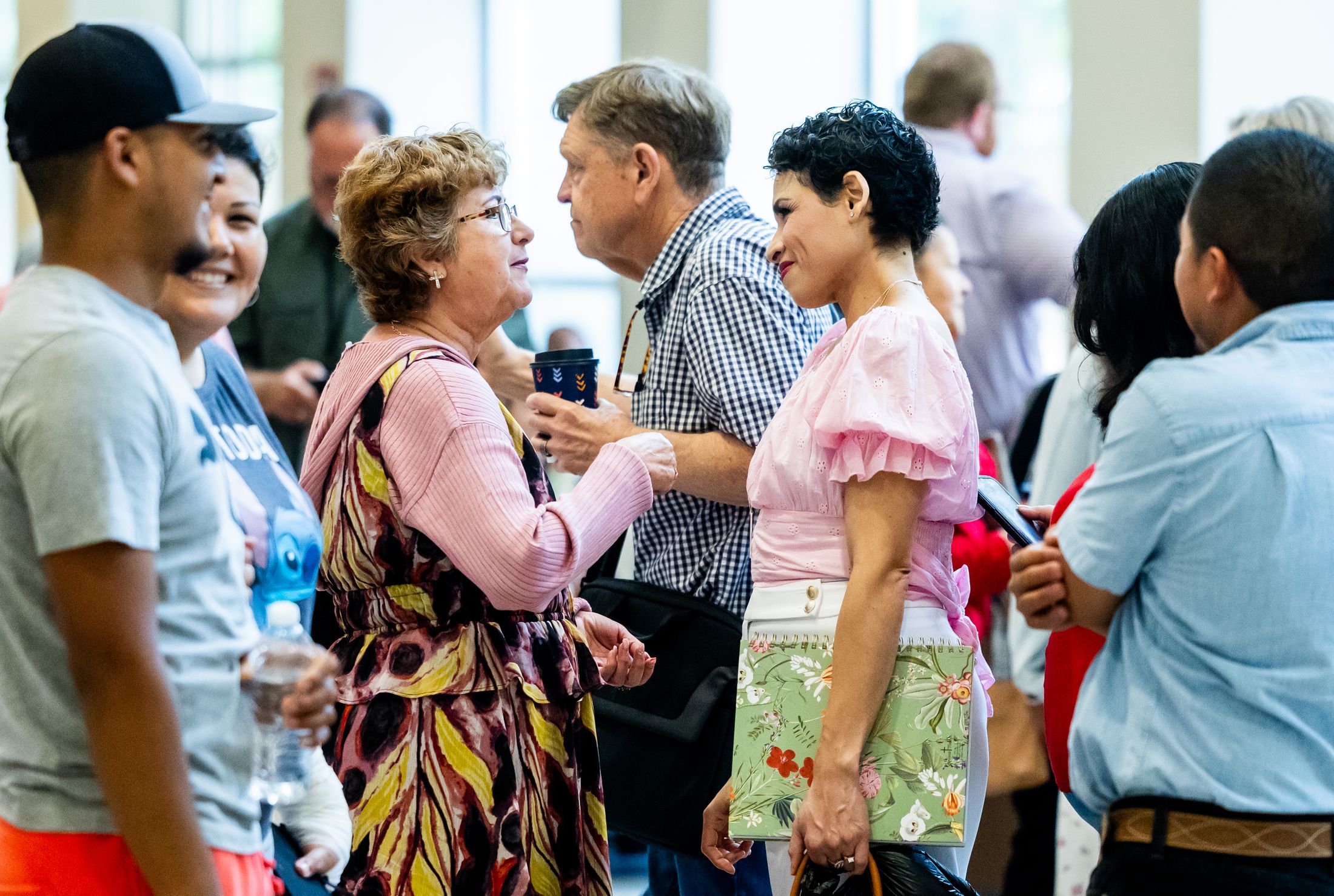 Members of a network in conversation at a gathering
