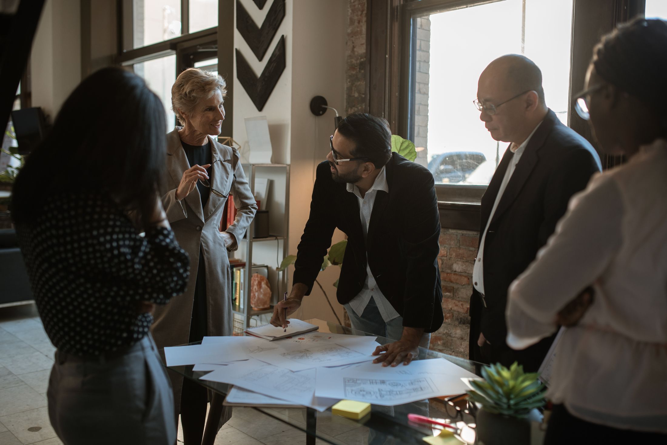 A working session — a small crew at the table